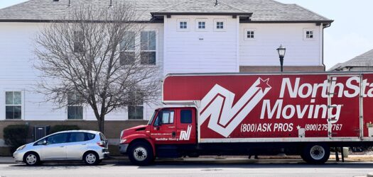 NorthStar Moving Long distance movers parked outside of a home in Texas
