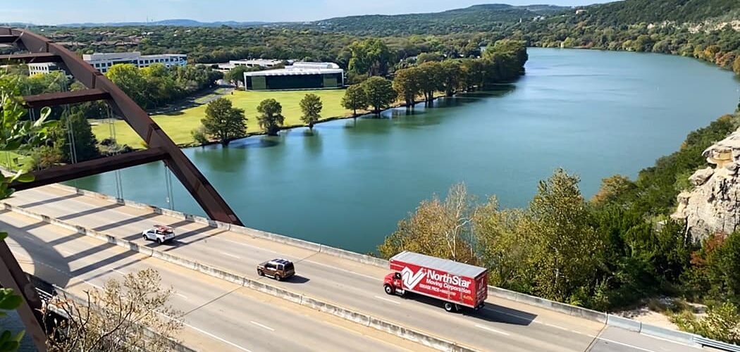 NorthStar Moving long distance movers in Austin driving across the Colorado River in Austin, TX