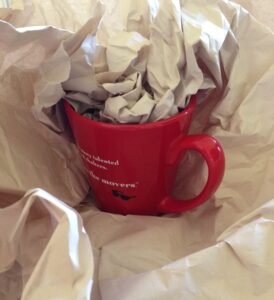 Packing experts at NorthStar Moving recommend stuffing packing paper inside mugs and cups.
