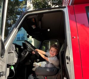 Child sitting in a NorthStar Moving truck 