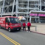 A NorthStar Moving team with our electric van during a move for the 49ers Foundation's 2026 annual Golden Getaway Weekend & Celebrity Golf Tournament
