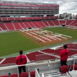 Two NorthStar Moving team members at Levi's Stadium, looking at the field.