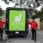 A NorthStar Moving team by our electric van.
