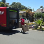 A mover delivering part of our 200 boxes donation.