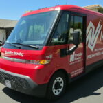 Our electric van parked in from of a location we delivered our boxes donation to.