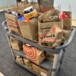 A card loaded with donation bags collected by the Jones & Jones community as part of Move for Hunger's Multifamily program. NorthStar Moving delivered them to the Hollywood Food Coalition.