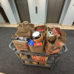 A card with donation bags collected by the Jones & Jones community as part of Move for Hunger's Multifamily program. NorthStar Moving delivered them to the Hollywood Food Coalition.