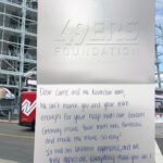 A hand written thank you letter from the 49ers Foundation to NorthStar Moving, on a background of a photo from one of the moves we did for them.